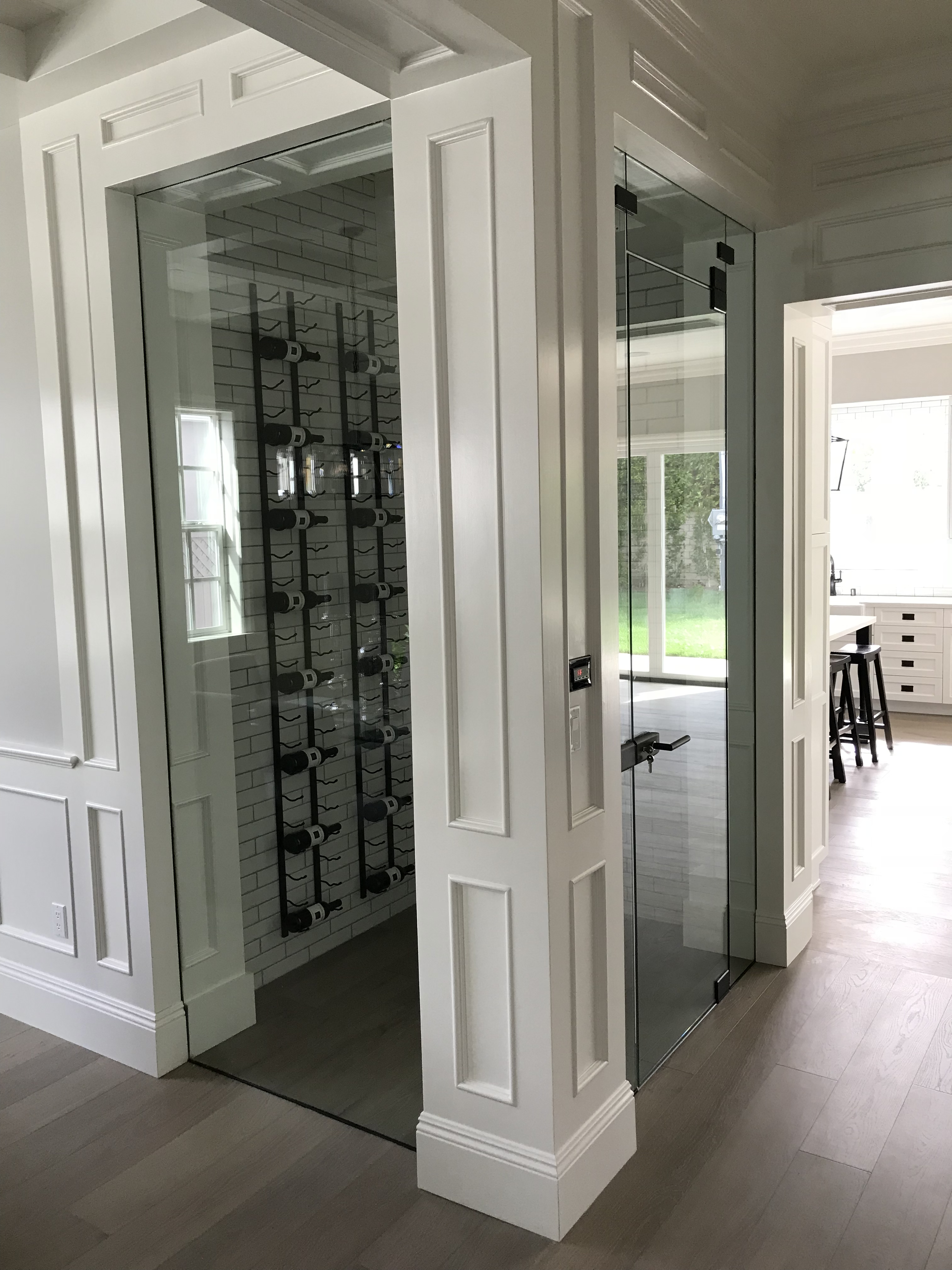 Custom glass wine cellar enclosure by DC Glass